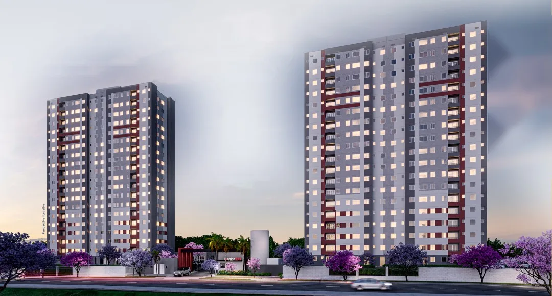Fachada do Inspire Residence, com as duas torres iluminadas ao entardecer